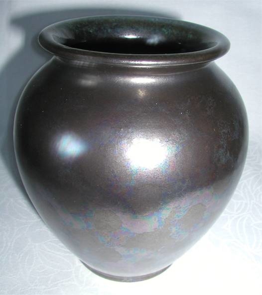Schöne graumelierte Vase aus Keramik. Made in Germany. Höhe 14cm. Durchmesser Öffnung 7cm. Wie neu.