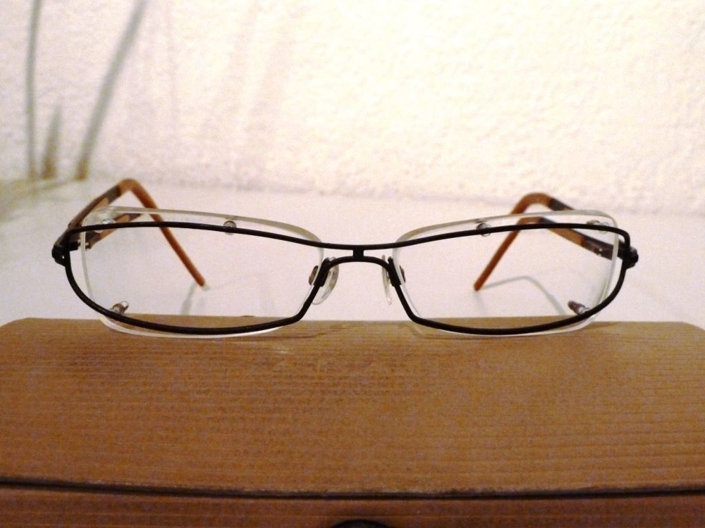 JOOP-Brillengestell randlos (und doch mit Rand), unisex, schwarz-braun-gold, original