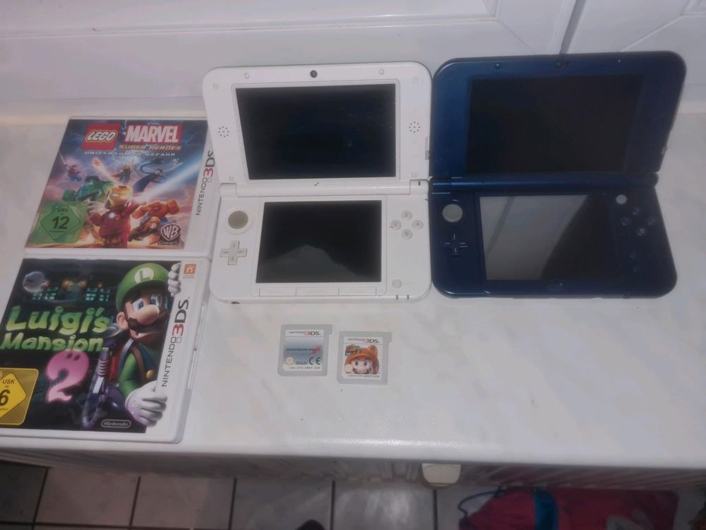 2 Nintendo 3DS XL Konsolen und 4 Spiele