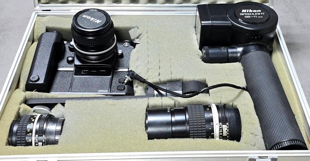  Nikon F3 mit Motor Drive MD 4 & Nikon Speedlight SB + 2 Objektive im Koffer