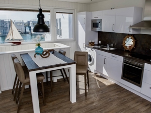 Schwimmendes Ferienhaus/Hausboot mitten im Hafen von Olpenitz! Bild 7