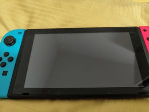 Nintendo Switch Konsole mit zwei Spielen und 3rd Party Controller Bild 1
