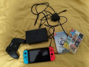 Nintendo Switch Konsole mit zwei Spielen und 3rd Party Controller Bild 2