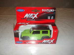 Suzuki Jimny 1:34 Welly Metall Modell neuwerig unbespielt OVP Bild 1