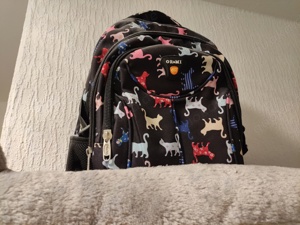 Rucksack mit Katzenmotiv abzugeben 