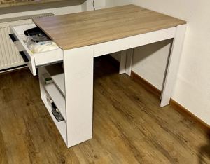 Small wooden dining table with storage space on the side