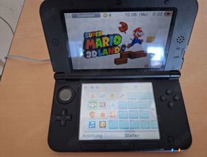 Nintendo 3DS XL rot + 4 Spiele, Tasche und Ladegerät