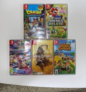 Nintendo Switch 4 joycon + 5 Spiele Bild 5