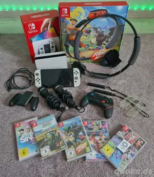 Nintendo Switch OLED Konsole Weiß, mit Ring Fit Adventure, Let s Sing usw.