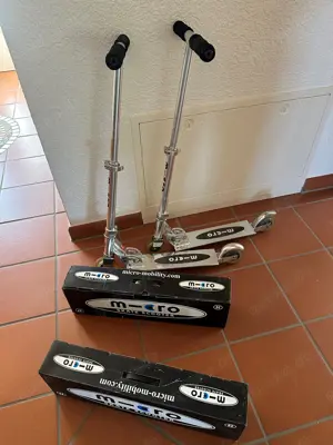 Tretroller microscooter mit Transporttaschen und Ersatzrollen, silber, gut erhalten, 