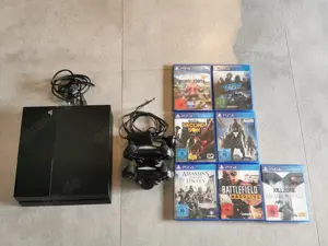 PS4 mit zwei Controller inklusive Ladestation und mehrere Spiele