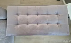 Rosa Polsterhocker mit Stauraum