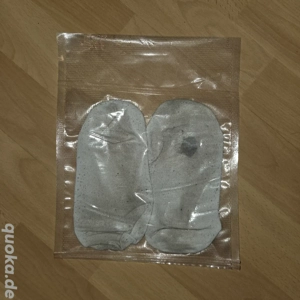 Socken getragen, vakuumiert und verschweißt
