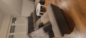 L-Sofa mit Hocker