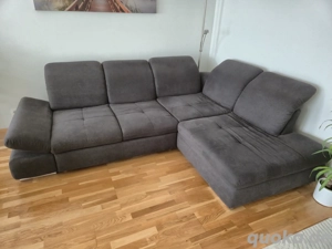 Wohnlandschaft aus Stoff mit Bettfunktion