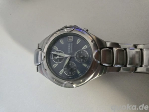 Fossiluhr mit Metallarmband