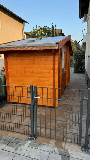 Gartenhaus (Fichte) mit Holzlager im Blockhausstil   gegen Gebot