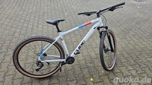 A year old Cube Aim SLX White n Blue with less than 100 kms ride