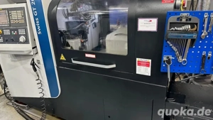 Verkauf steht ein CNC-Langdrehautomat TORNOS GT 26 6 II, inklusive Stangenlader