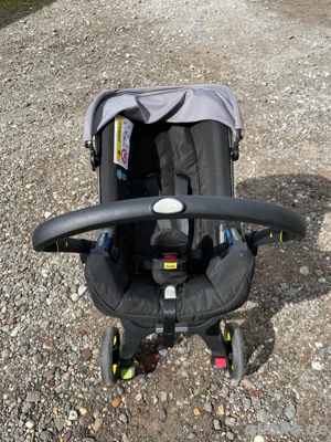 Doona+ 2 in 1 Babyschale mit Kinderwagenfunktion