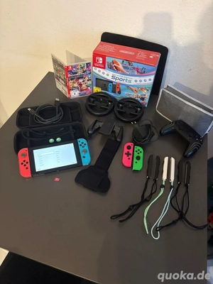 Verkauft wird eine Nintendo Switch Rot Blau rund um sorglos Paket