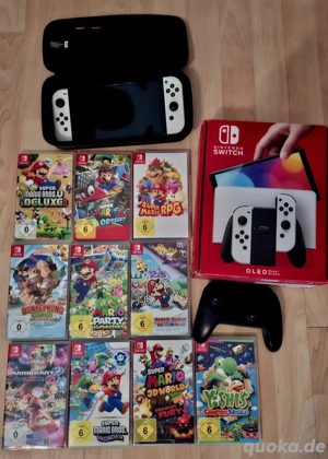 nintendo switch OLED modell spiele mit sammlung videospiele und rechnung 
