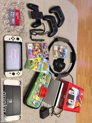 Nintendo Switch OLED Modell mit animal crossing und Mario kart 8 videospiele 