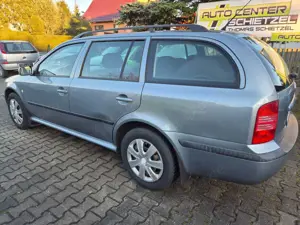 Skoda Octavia Tour *1.Hand*Klima*TÜV-10/26*So+Wi-Räder* Bild 2