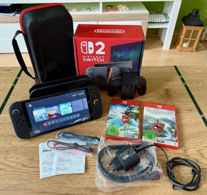 nintendo switch 2 spiel Konsole mit verpakung und  2 videospiel 