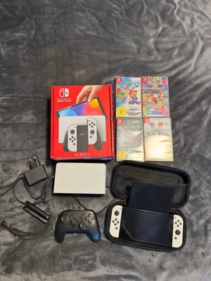 Nintendo switch Oled modell spielkonsole mit 4 spiel und verpakung