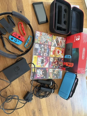 nintendo switch konsole mit videospiele und verpakung 