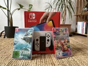 nintendo switch Oled spielkonsole mit rechnung mit verpakung mit Zelda un Mario kart spiel 