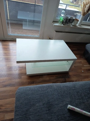 Große graue Eckcouch mit Ottoman und Kissen und Tisch  Bild 4