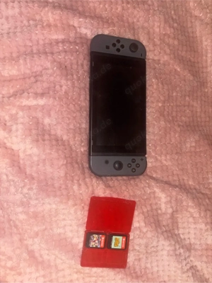 Nintendo Switch mit zwei Spielen Bild 3