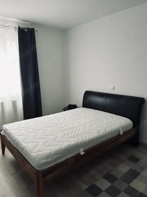 Bett Leder Echtholz Massivholz Jysk dunkelbraun schwarz  