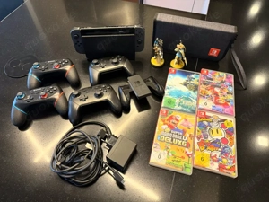 Nintendo switch V1 spielkonsole mit sammlung 4 Spielen und 4 original Controllern 