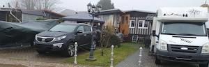 Sehr gepflegtes Wohnmobilheim auf Pachtgrundstück mit Wintergarten, Pavillon und 3 Stellplätzen
