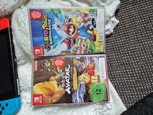 Nintendo switch mit 4 spielen  Bild 2