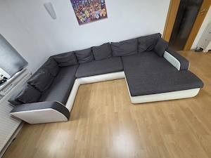 Wohnlandschaft mit Bettkasten,schlaffunktion und Zierkissen zu verkaufen.