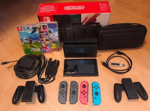 nintendo switch mit 3 2x Zelda spiele + Mario kart 8 Deluxe spiele und verpakung 