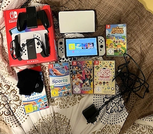Nintendo Switch OLED spielekonsole + 4 spiele 