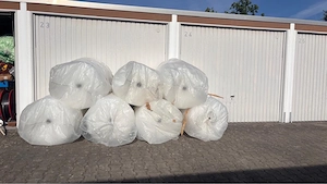 Kartonage Versandmaterial Luftpolsterfolie Holzkiste Florapark