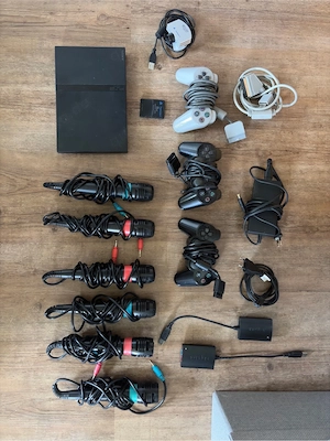 PlayStation 2 Slim, 29 Spiele, 6 mikros & Eye Toy Kamera