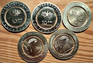 10.-  Münzen