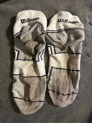 vollgeschwitzte Socken Wilson vakuumverpackt